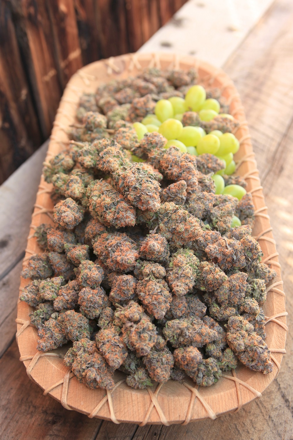 Grapes and cannabis buds side view at High Country Healing store in Alma, CO